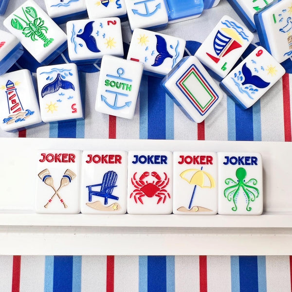 Collection of colorful game tiles with various symbols on a striped background