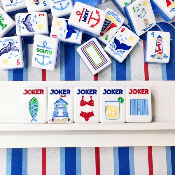 Collection of colorful game tiles with various symbols on a striped background