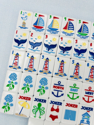 Set of tiles with nautical-themed designs on a light blue background