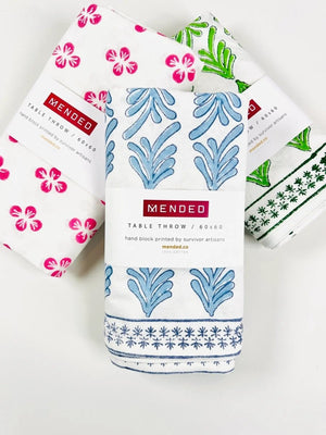 Packaged Mended Tablecloths in Green, Blue, and Pink